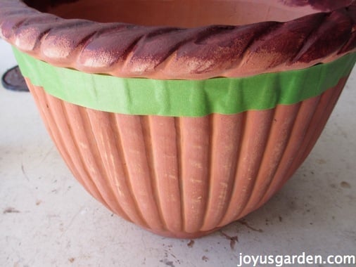 Adding painters tape to the terracotta pot