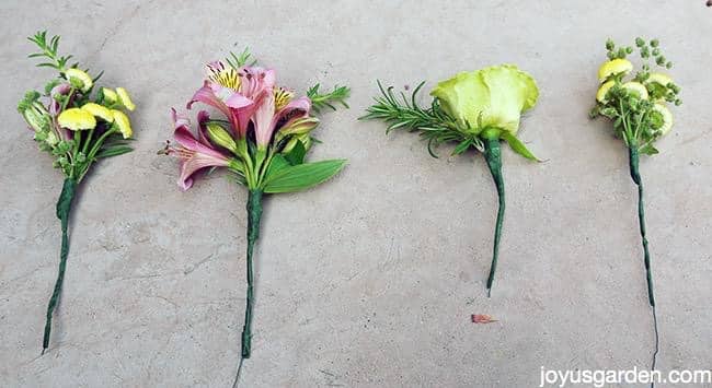 Bundles of flowers with an herb accent