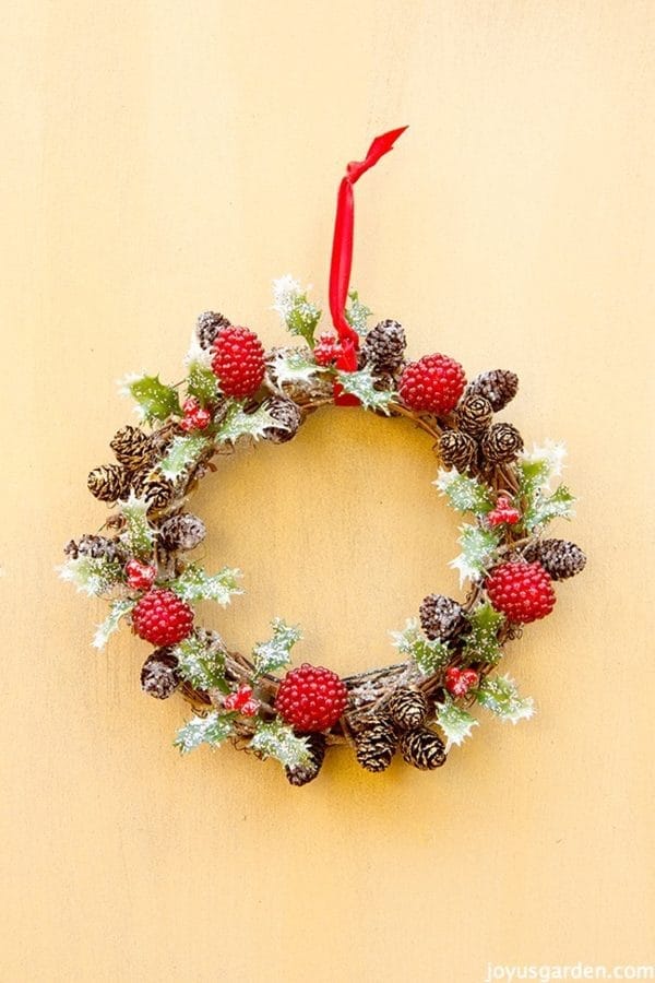 A Holly Berry Vine Wreath Christmas Ornament