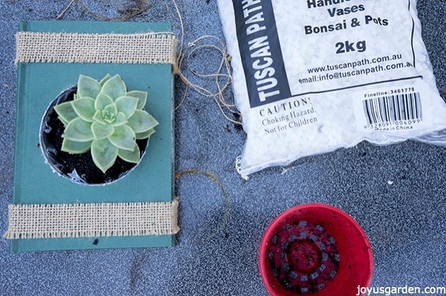 vintage book used as a container and bag of pebbles