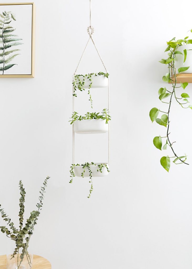 A 3-tier white hanging planter.