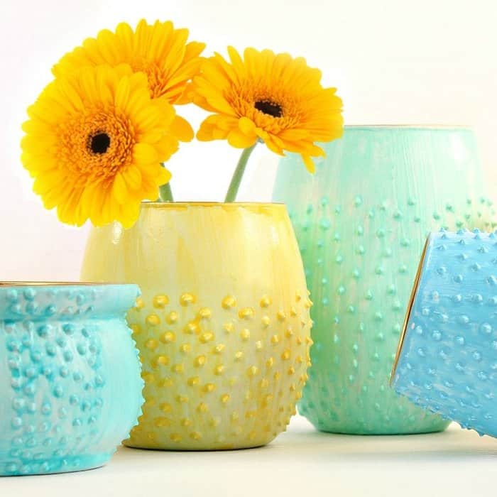 close up of pastel yellow, green & blue diy vases