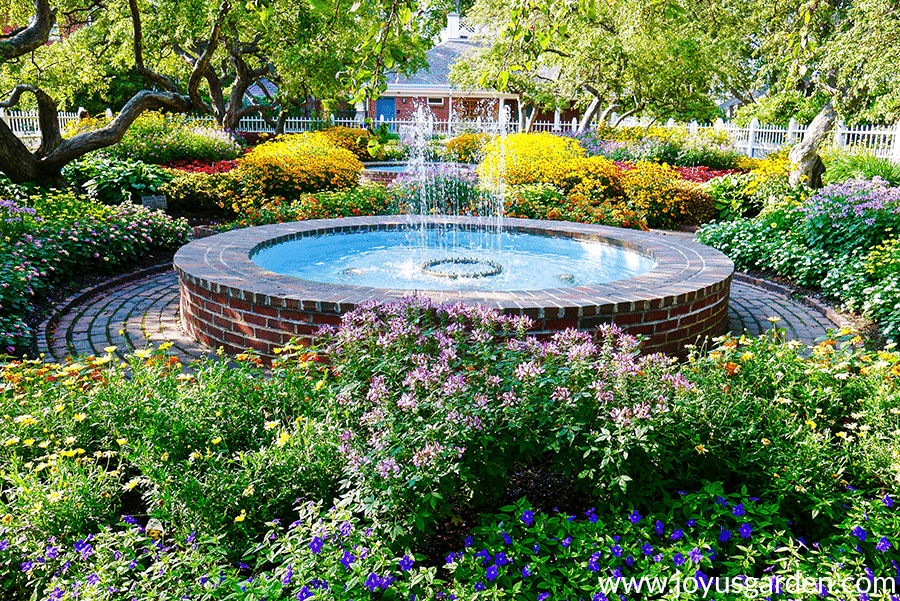 a beautiful flower garden with a water feature in portsmouth nh