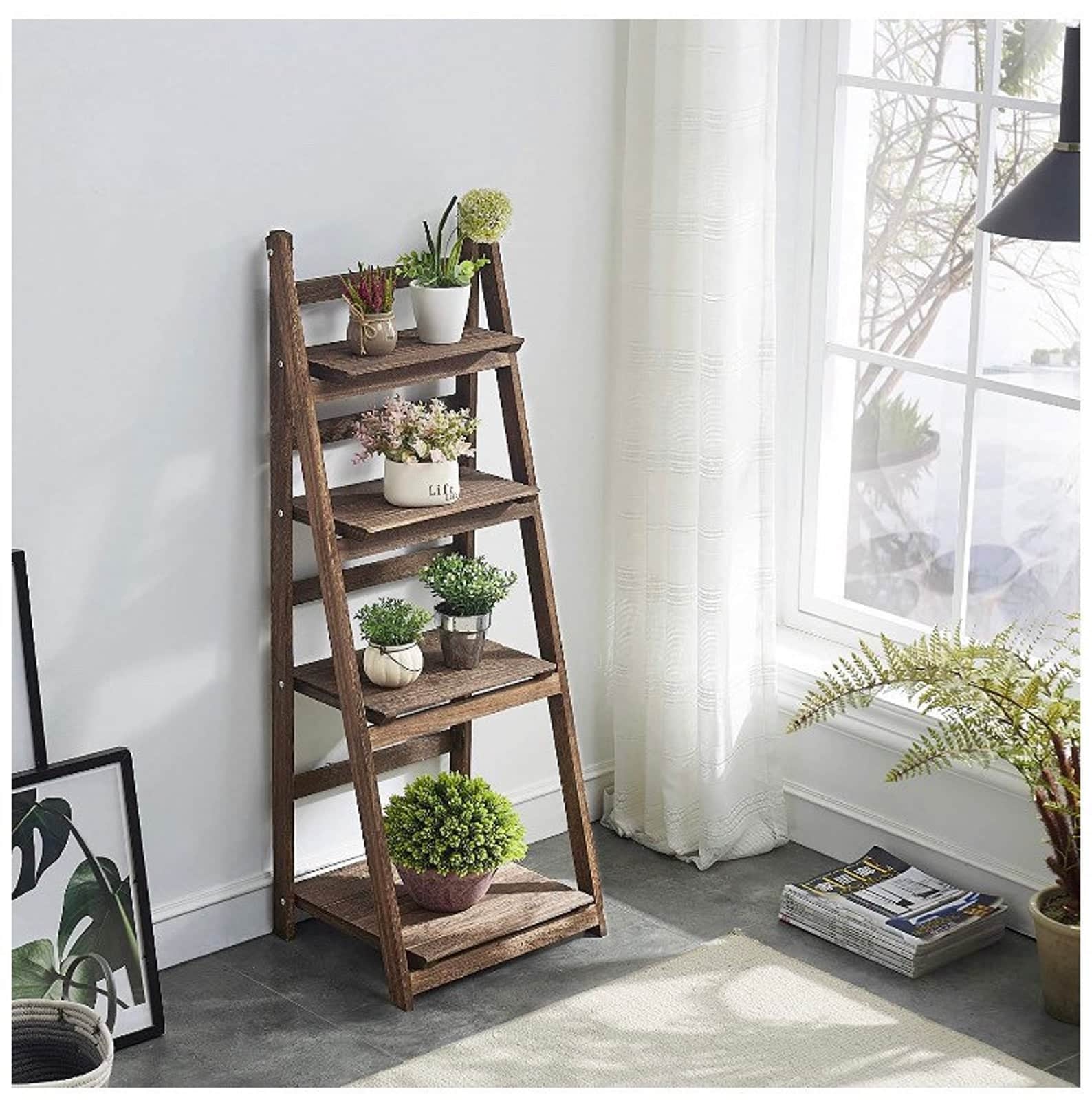 Four tier ladder plant stand in a brightly lit room. 