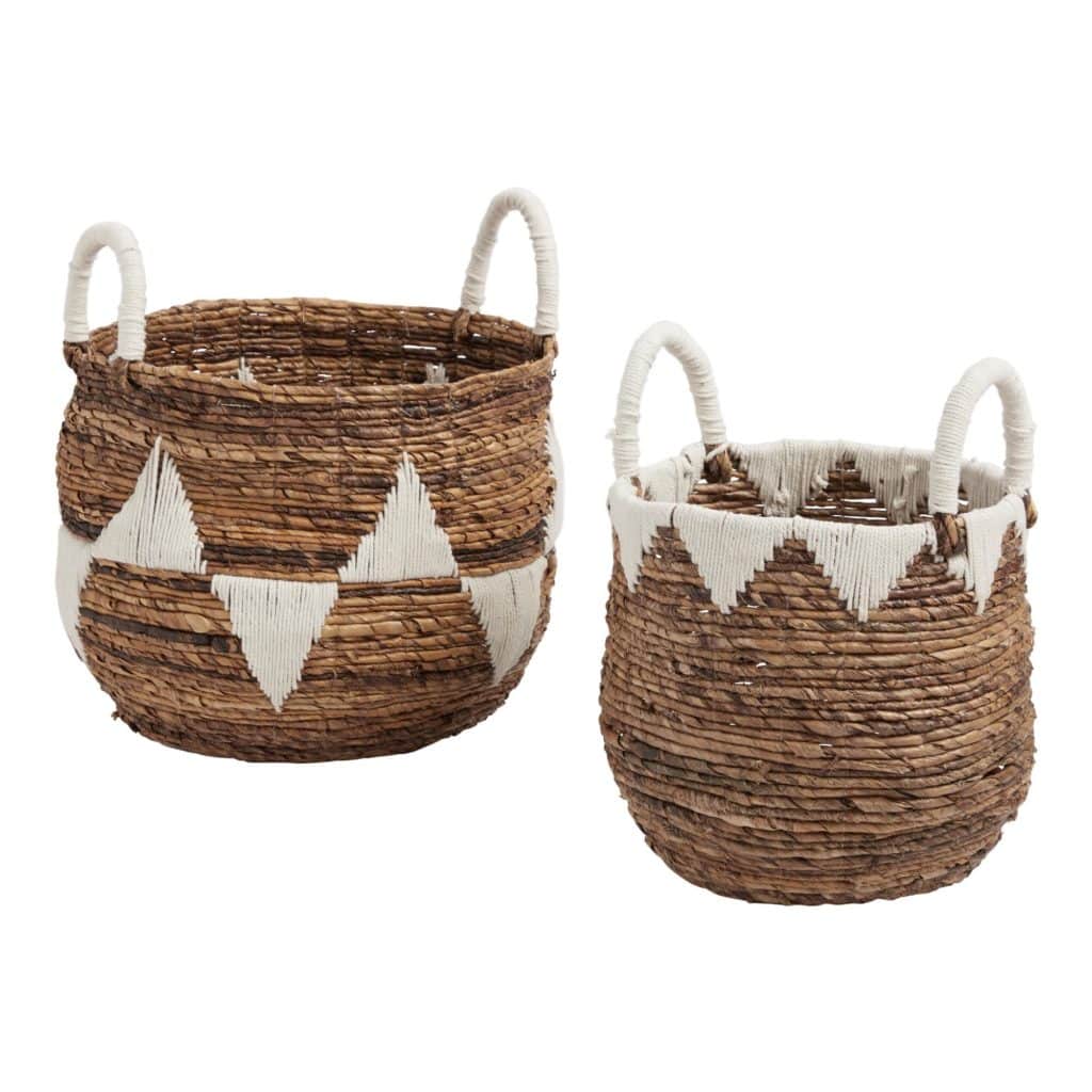 two tote baskets with white handles and triangular pattern design available at world market