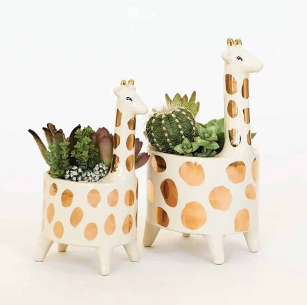 Two gold giraffe planters available at etsy.