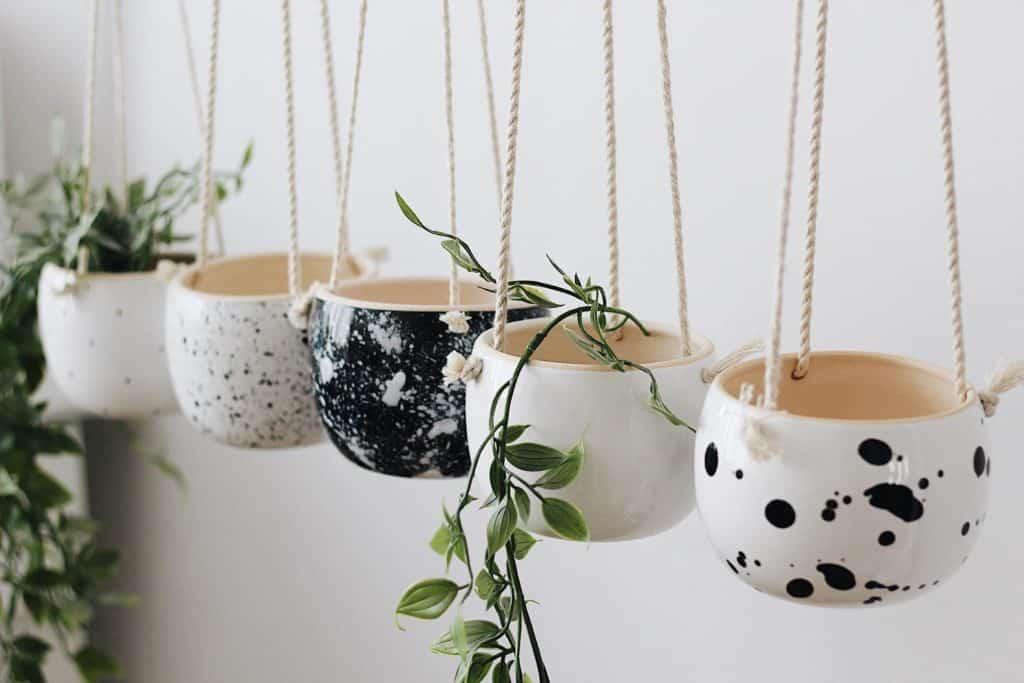 5 black and white hanging planters from etsy