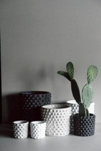 six ceramic pots in black and white from all modern