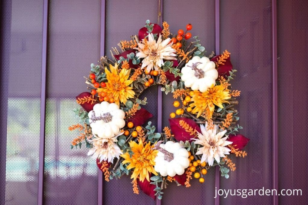 fall wreath hanging on front door