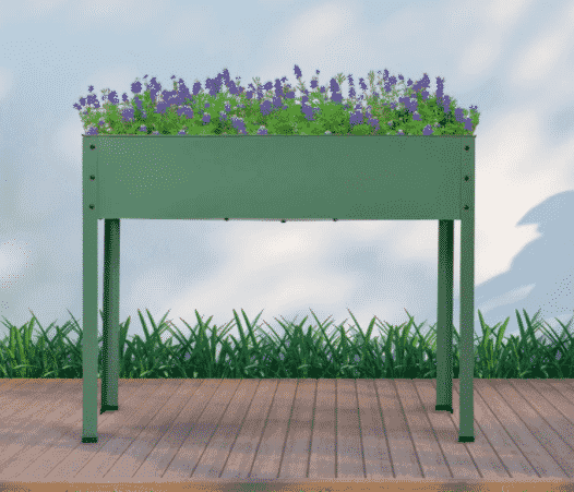 Raised planter with purple plants potted inside from wayfair.