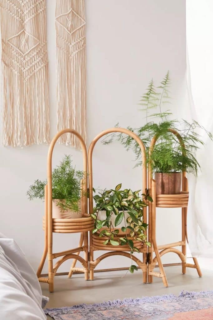 rattan multi tier plant stand indoor at urban outfitters 