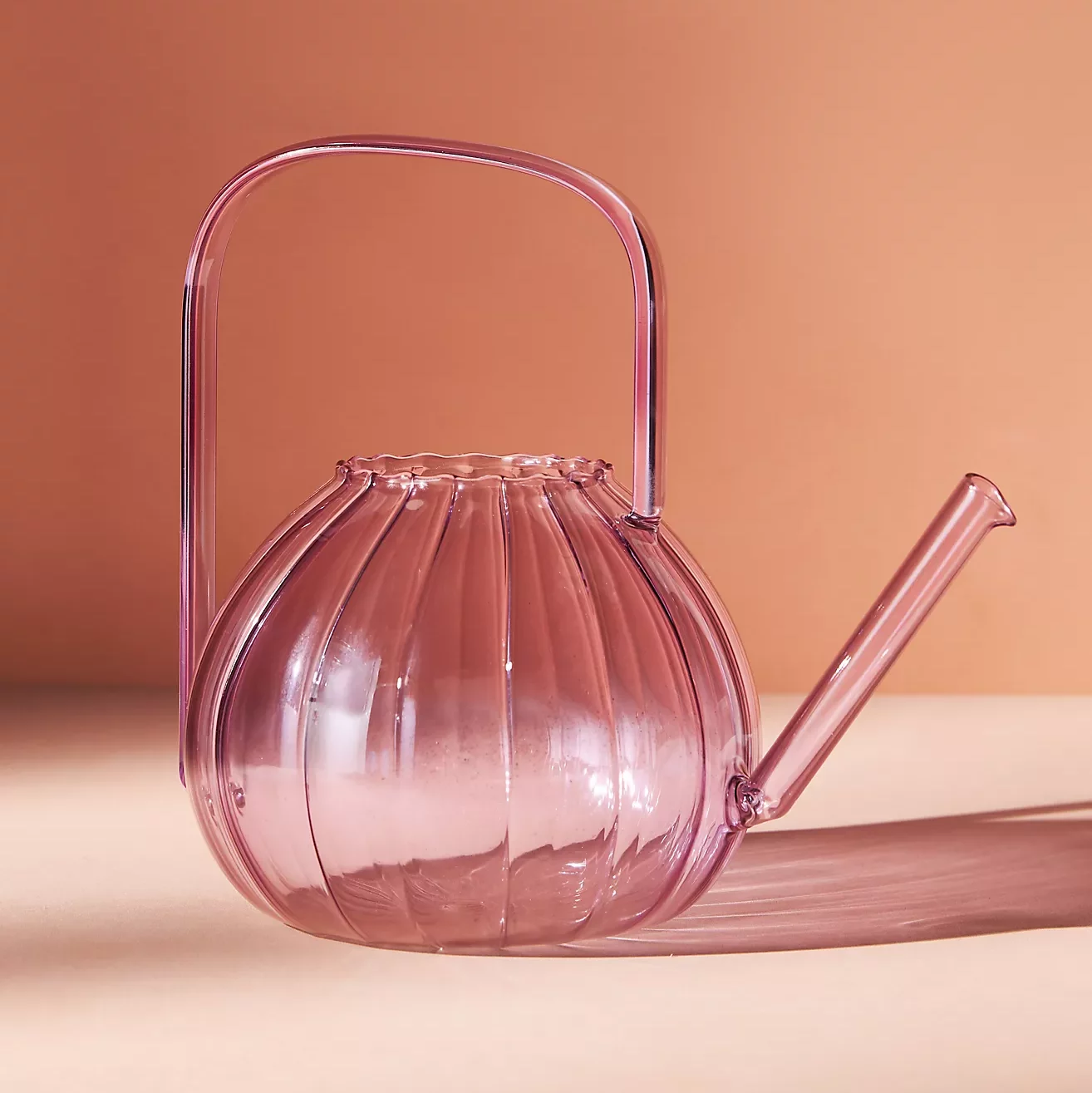 pretty pink decorative glass watering can from anthropologie