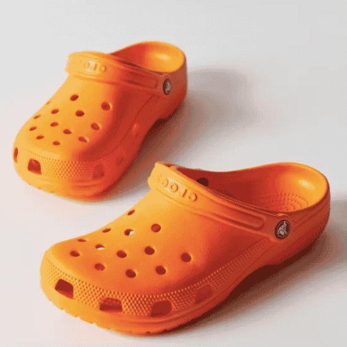 pair of orange clogs from urban outfitters