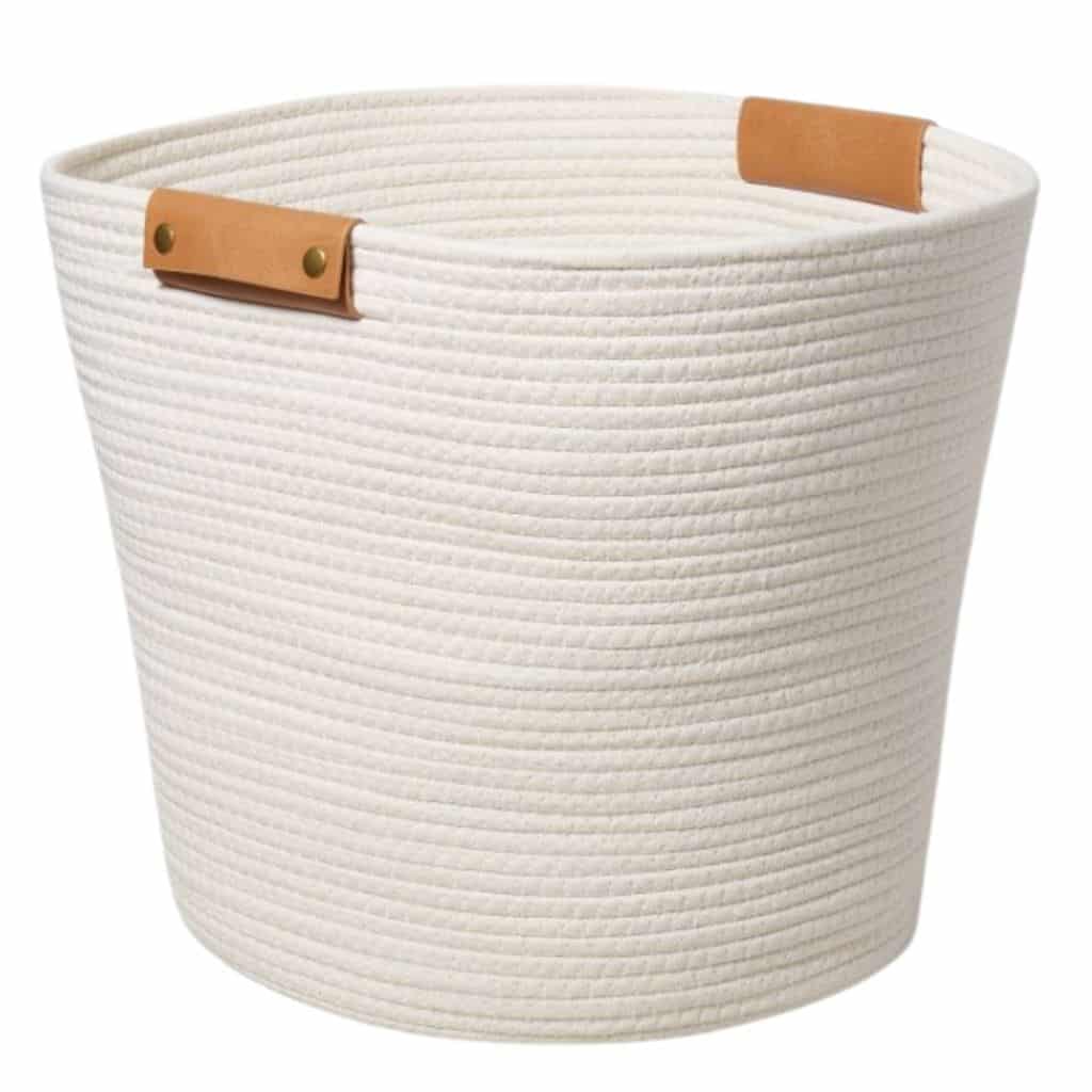 white rope coiled basket 14 by 17 inches tan leather handles on each side from Target