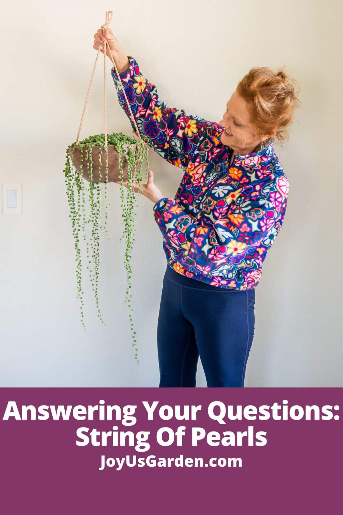 Woman in floral sweatshirt holding string of pearls plant and trails are hanging down text reads answering your questions string of pearls joyusgarden.com.