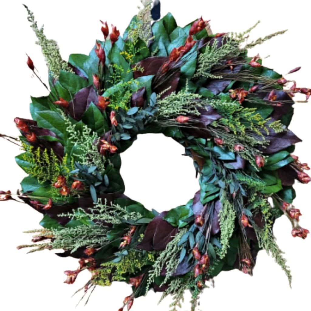 natural wreath made of preserved green and burgundy salal leaves, preserved green caspia, and preserved red bell grass from etsy