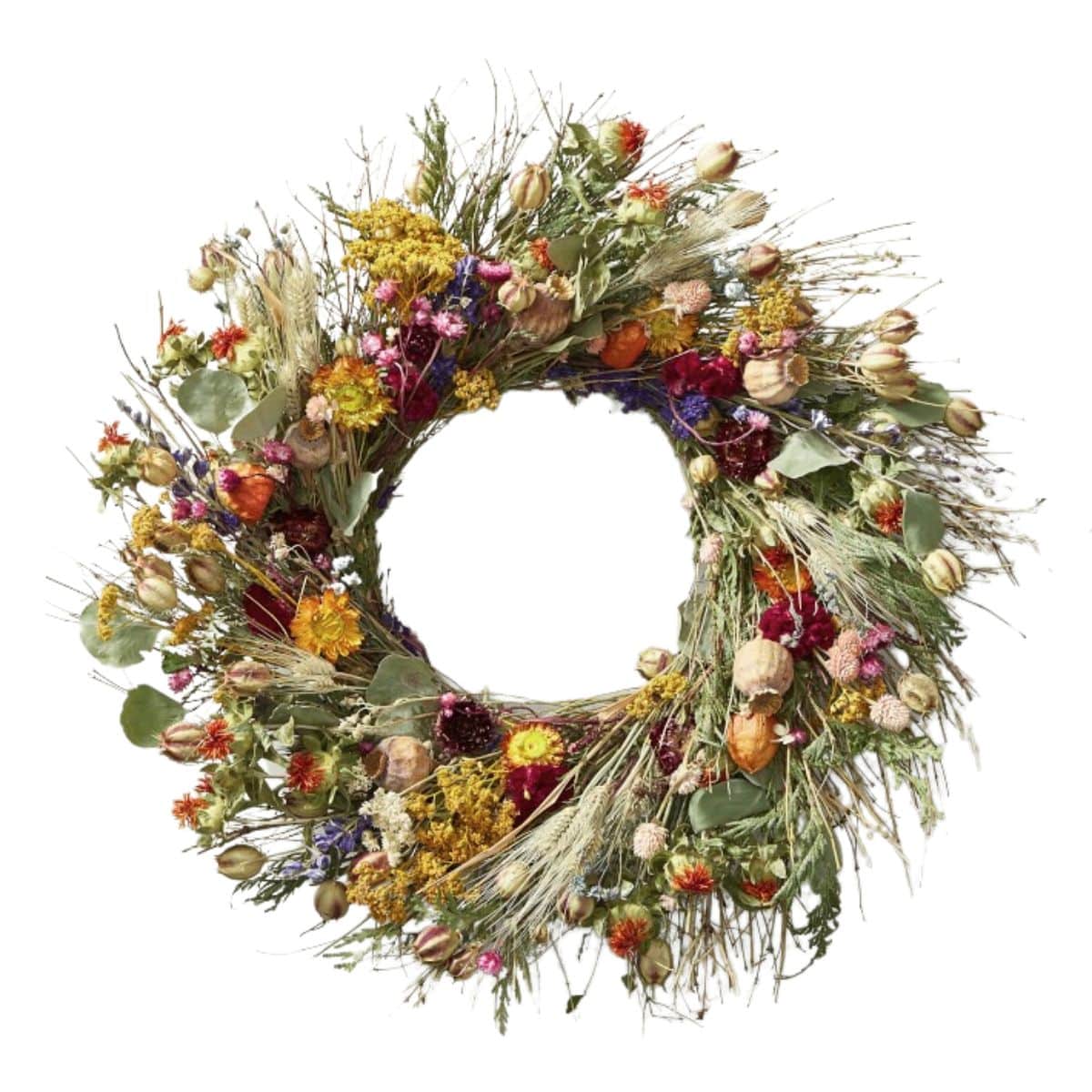 wreath made of lavender, poppy pods, celosia, yarrow, larkspur, wheat, nigella, eucalyptus from williams sonoma