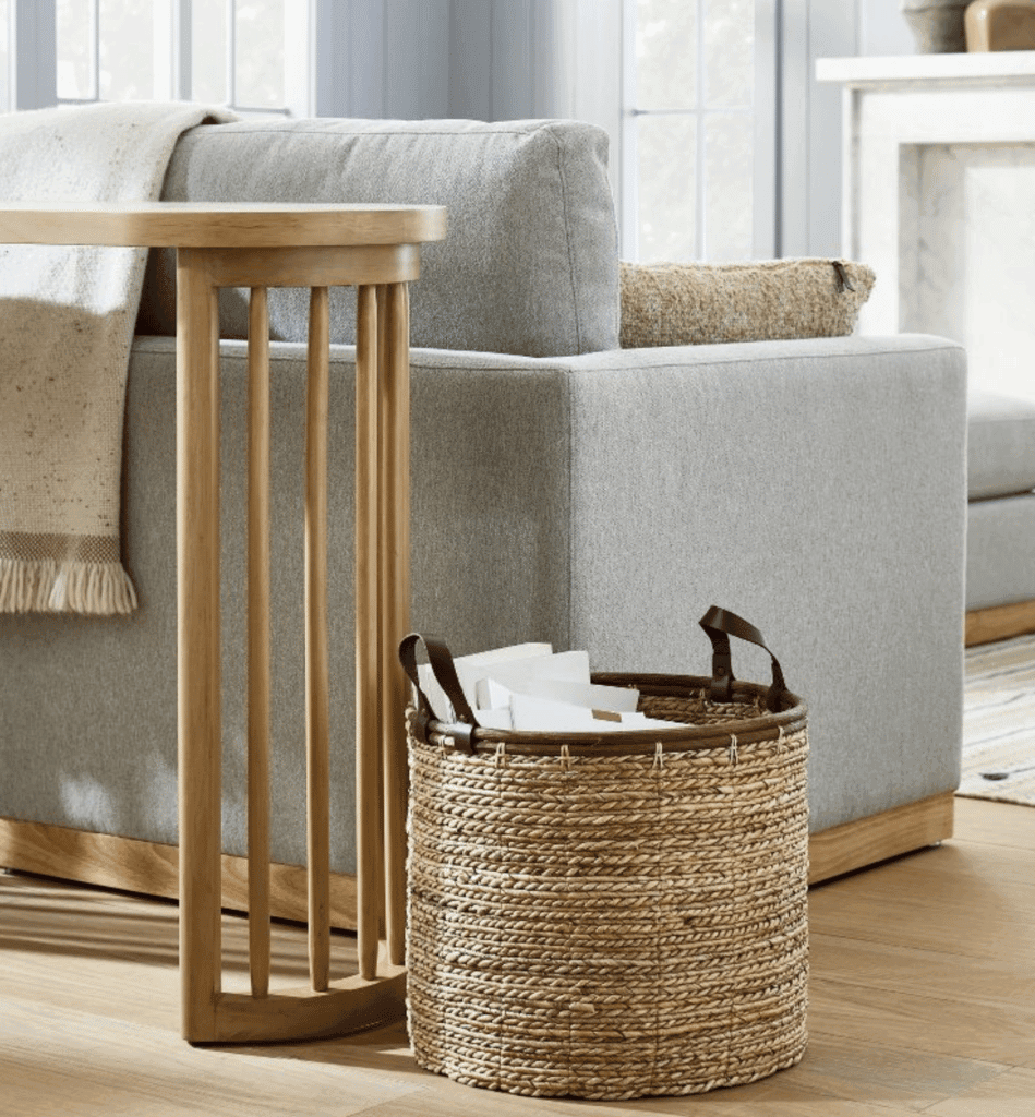 a tan woven basket with brown leather handles to buy at target