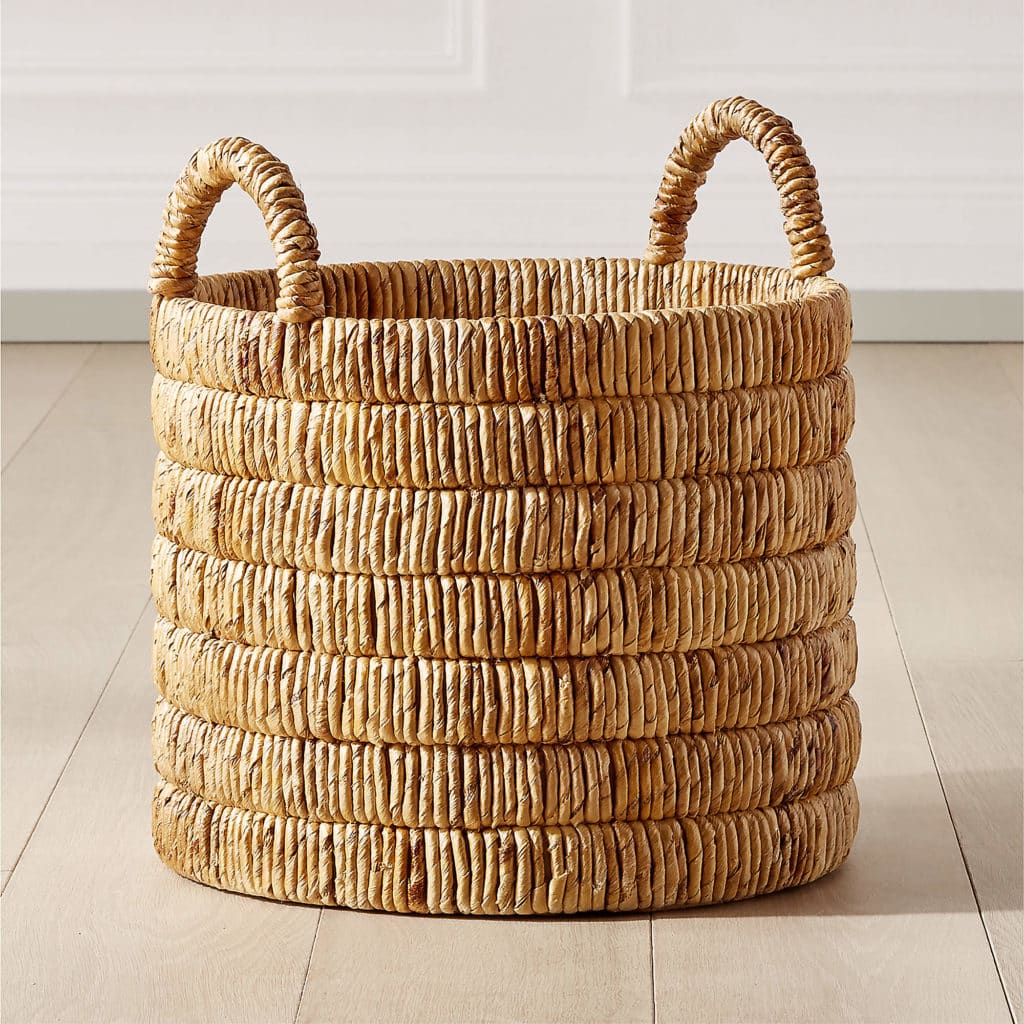 the large milos baskets woven from tan banana leaves with handles to buy at cb2