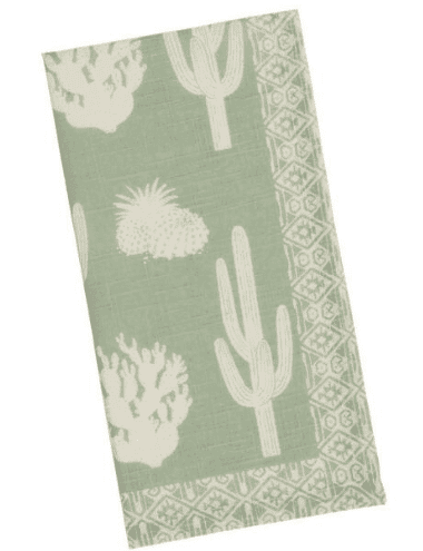 sage green cactus napkins with white deign of desert cactus and other plants from world market