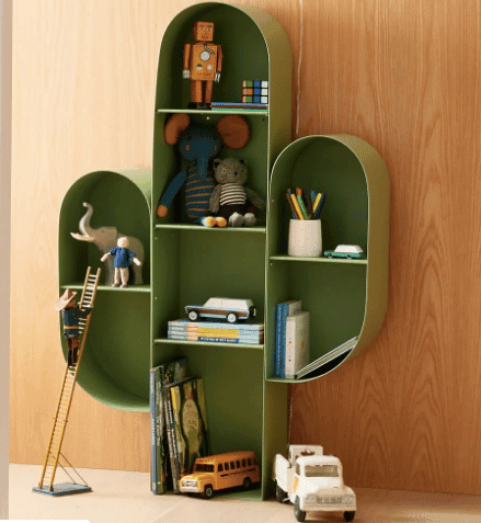 cactus bookcase filled with kids toys and books from west elm