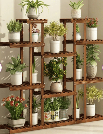 multi tier wood plant stand with a variety of plants shown from wayfair