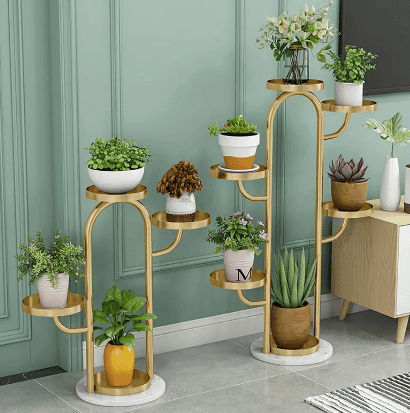 gold multi tier metal plant stand with a variety of plants shown from Amazon