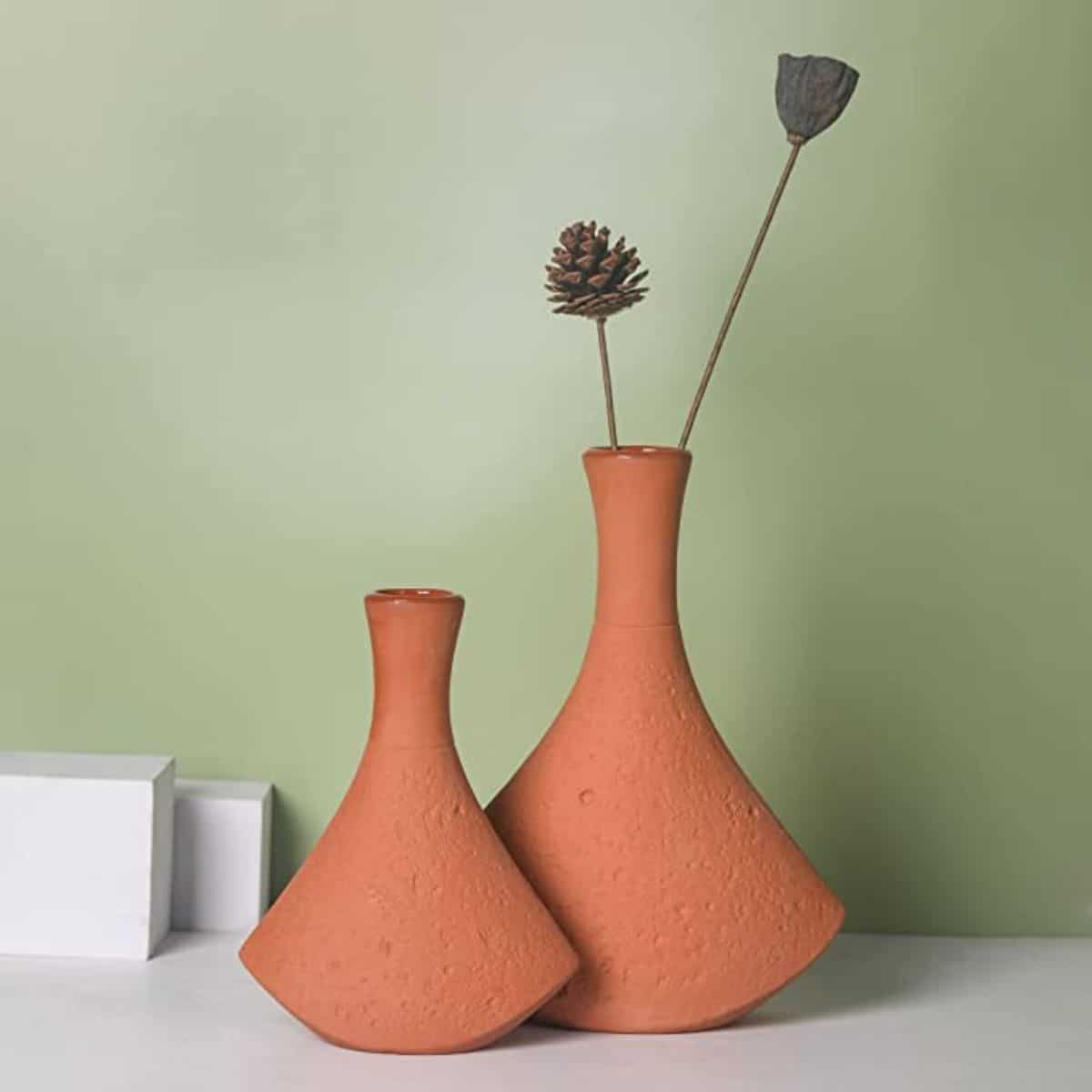 two terracotta color vases with angular shape styled with dried botanicals from amazon
