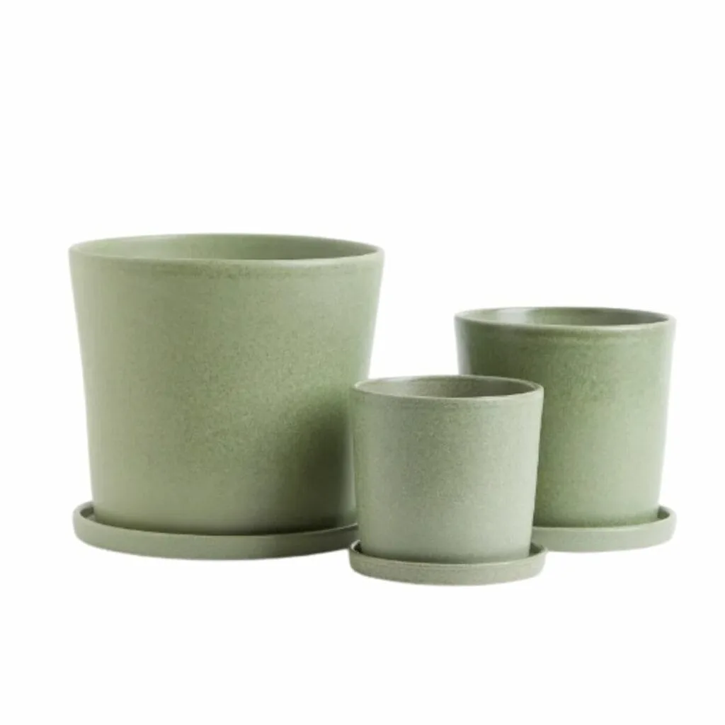 Three green Glazed Terracotta Plant Pots and. saucers from H & M.