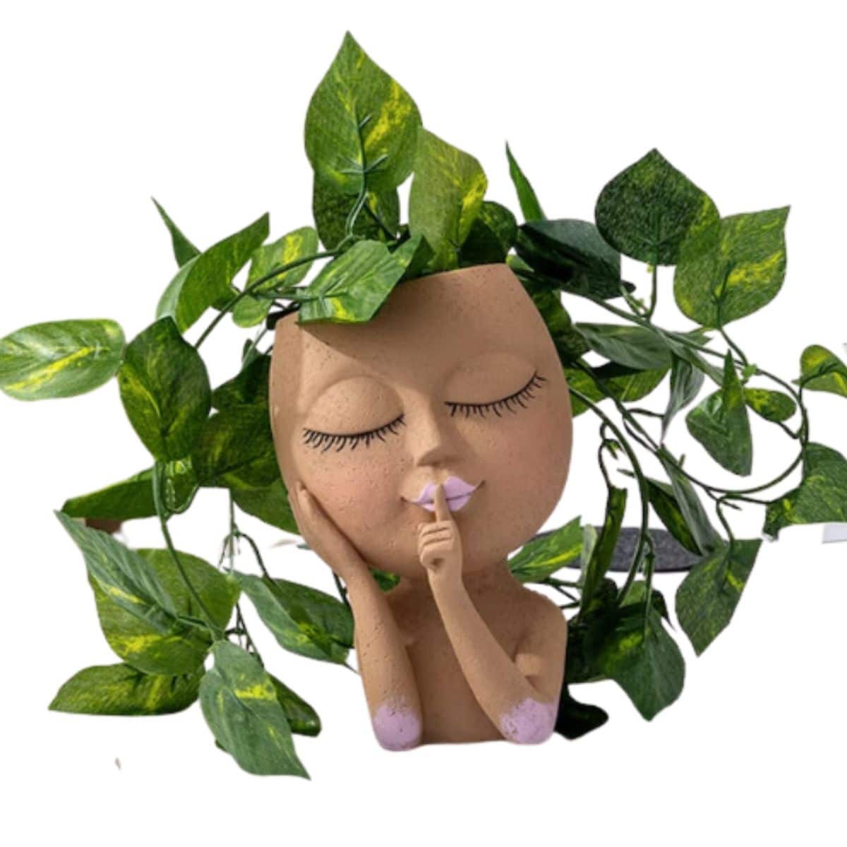 Doll face head planter with pothos inside from Etsy. 