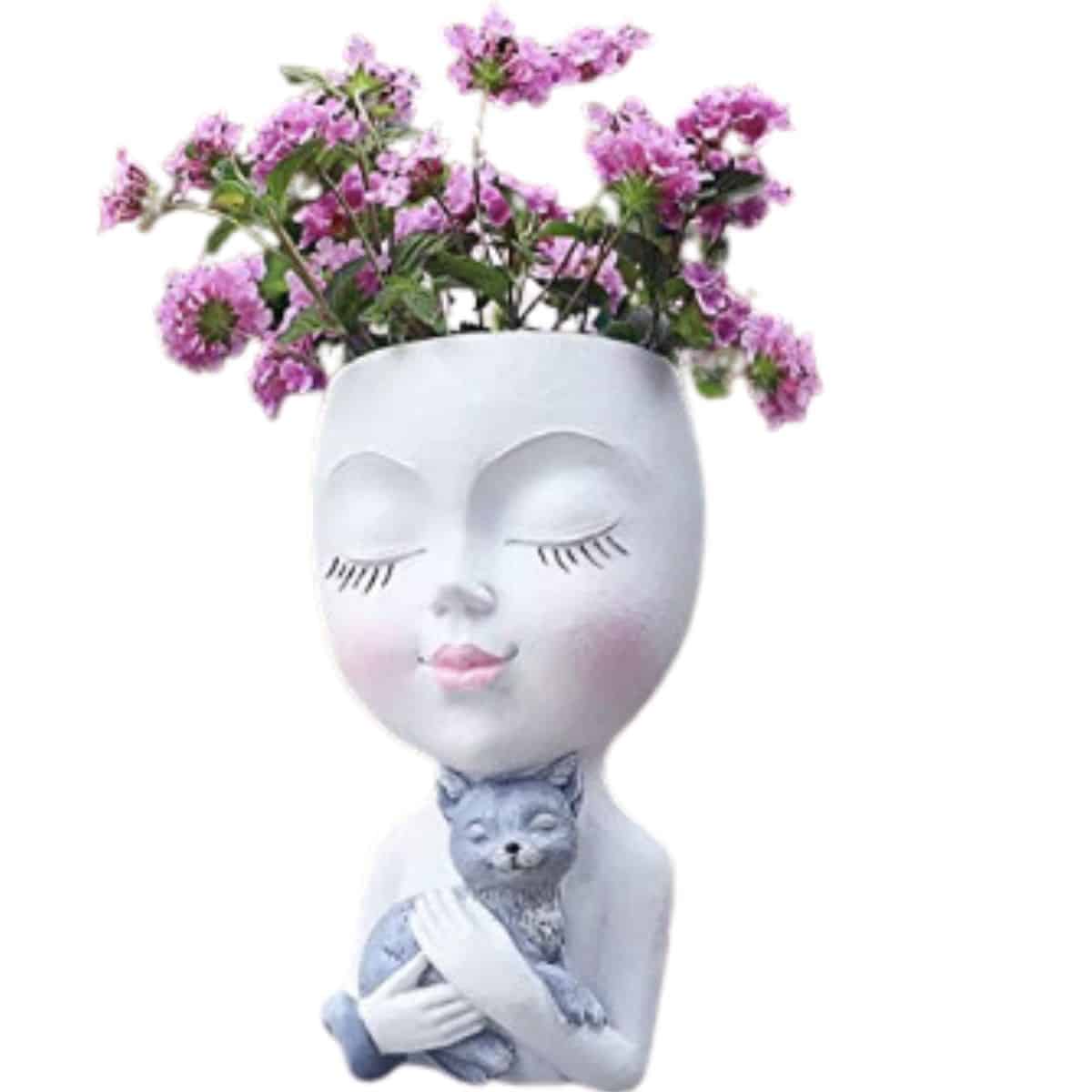 Lady face hugging a cat face planter. 