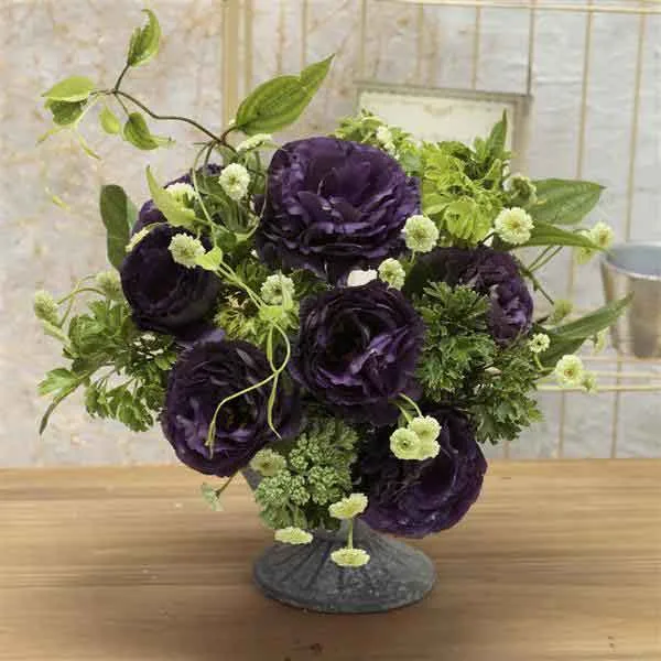 Lisianthus black pearl bouquet floral arrangement in a vase indoors.