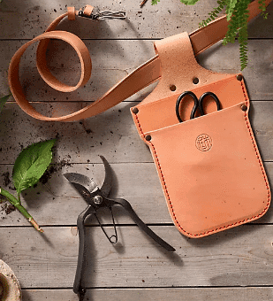 Leather garden tool belt and garden tools from anthropologie.