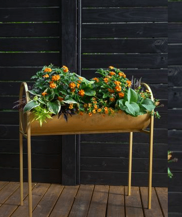 Gold trough table metal planter box with plants inside for outdoors from yard epic.